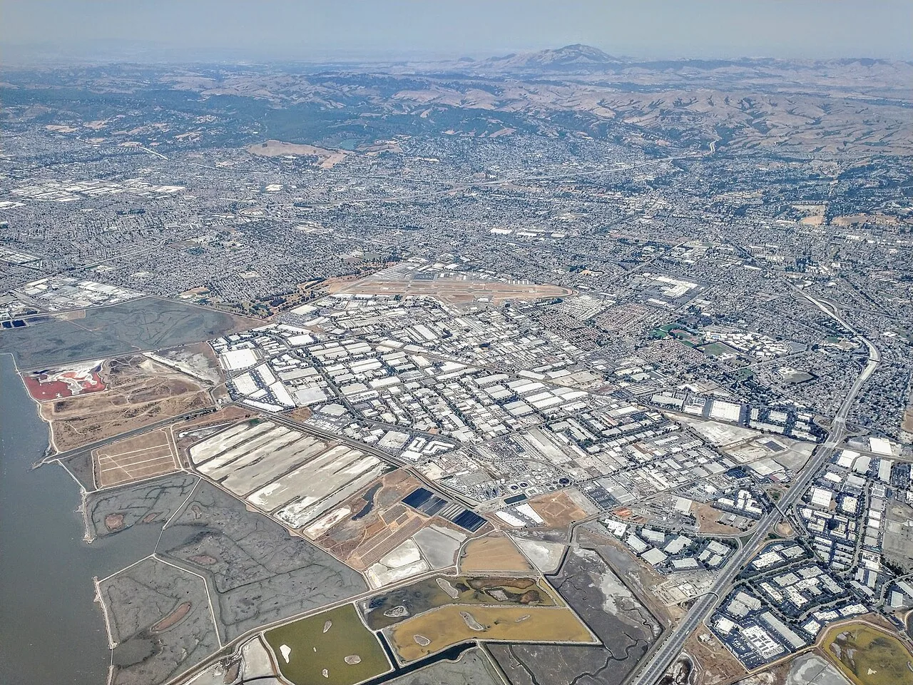 Aerial view of Hayward industrial districts along the bay shoreline